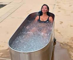 Lady sitting in a cold ice bath